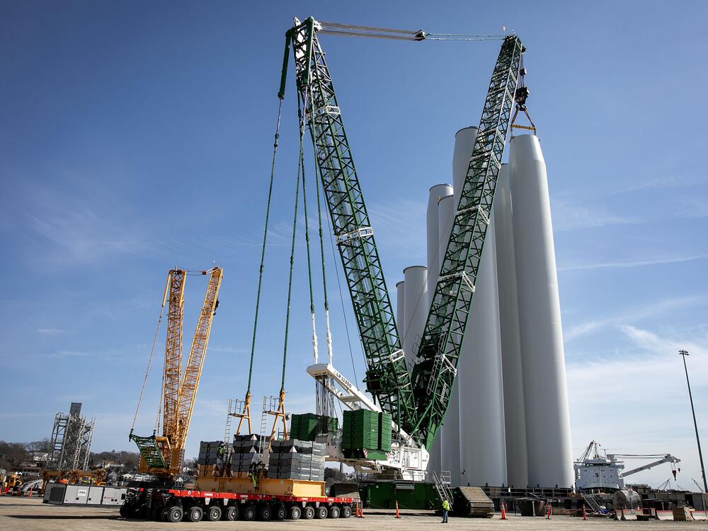 A crane stacks turbine components at the New London State Pier Terminal. The offshore wind industry has generated millions of dollars for the city and local economy in recent years.