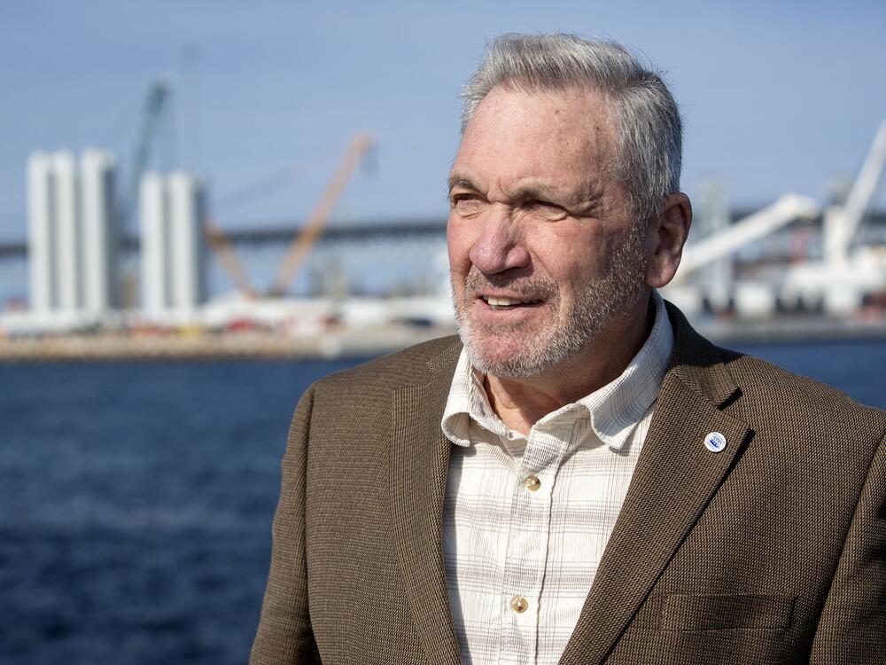 New London Mayor Michael Passero says offshore wind has contributed to the city's recent renaissance. Behind him sits the State Pier Terminal, the centerpiece of the local industry.
