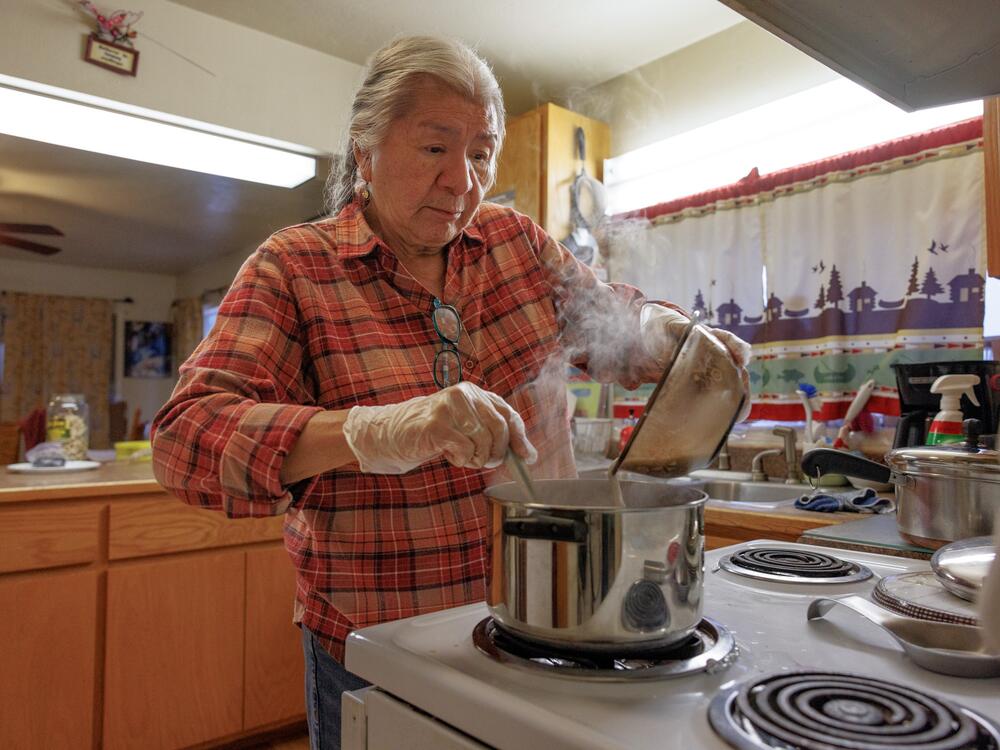 Mary Jane Charlo stirs a pot of berry soup.