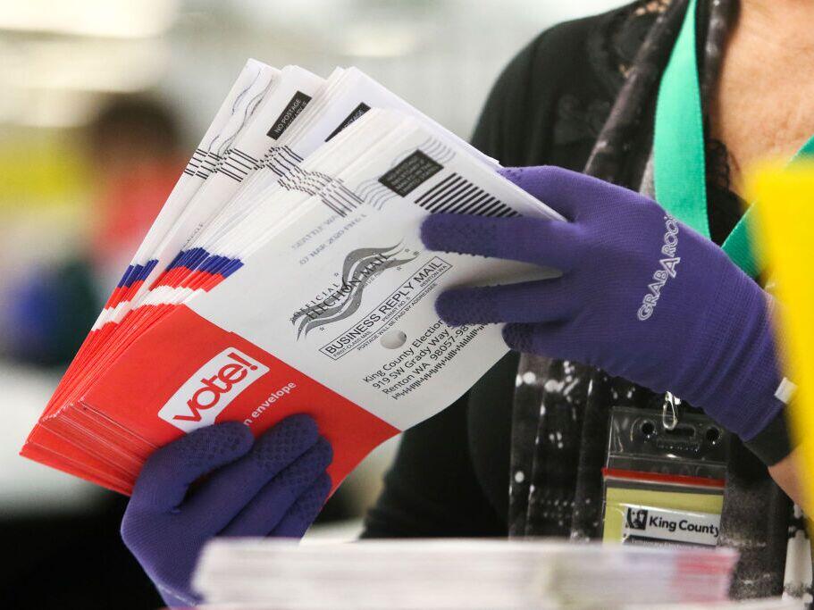 An election worker sorts vote-by-mail ballots for the presidential primary at King County Elections in Renton, Wash., in March 2020.