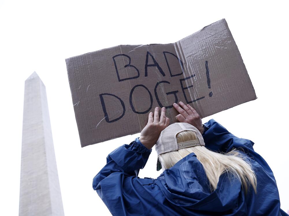 A demonstrator takes part in the Hands Off! day of action against the Trump administration and Elon Musk on April 5 on the National Mall in Washington, D.C. More than 100,000 attended the rally.