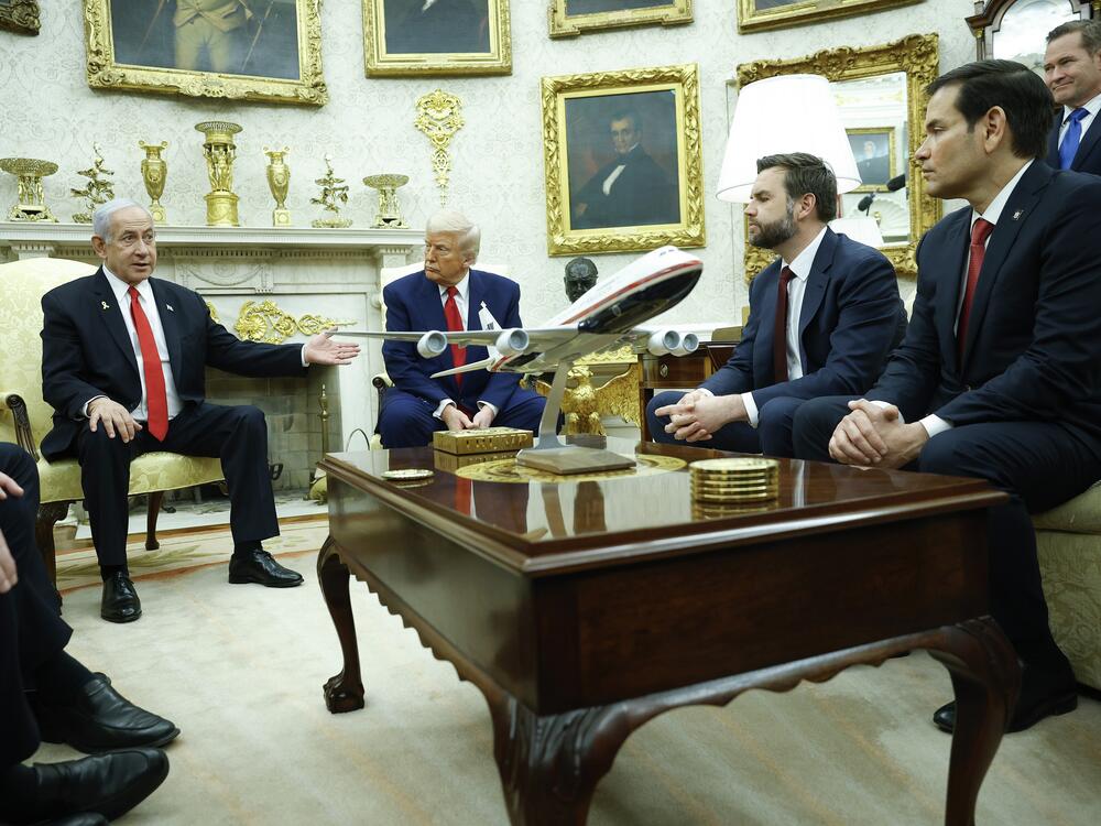 Israeli Prime Minister Benjamin Netanyahu (left) speaks alongside President Trump, with a model of Air Force One on the table, during a meeting in the Oval Office on April 7. Vice President Vance and Secretary of State Marco Rubio were also in attendance.