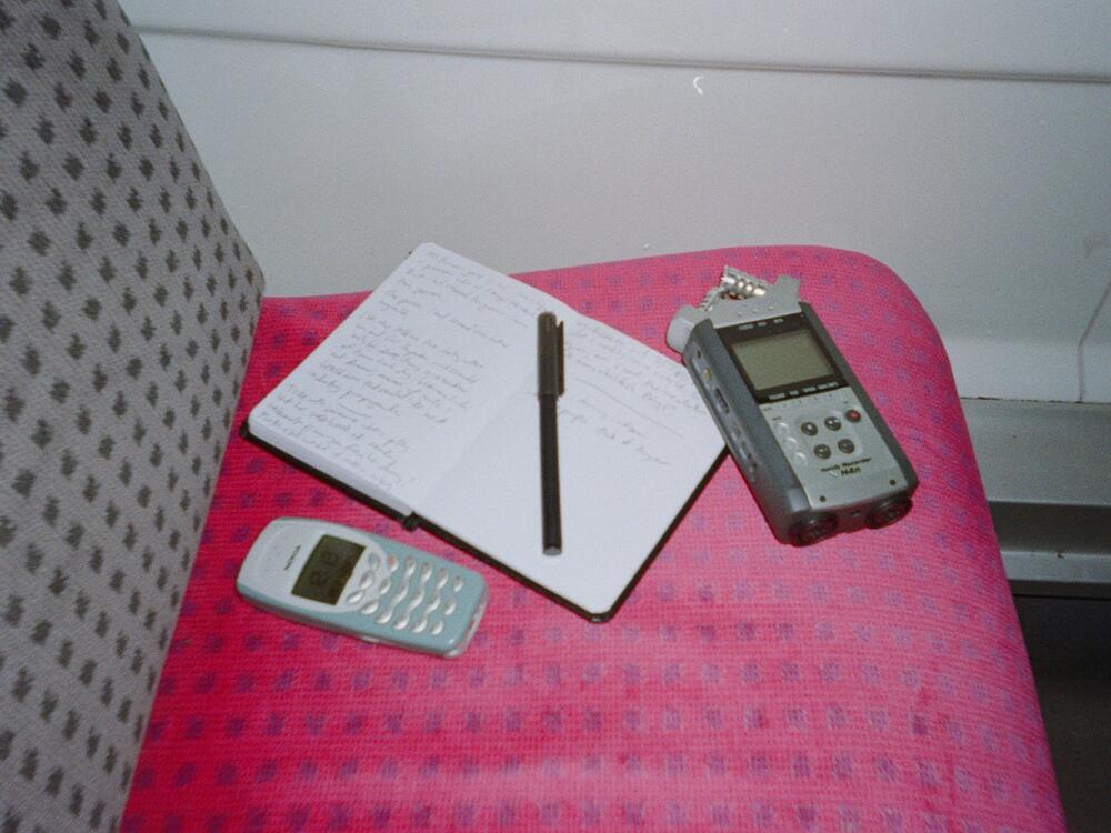 Lamm's journalism kit includes a dictaphone she uses to conduct interviews and record music demos, her dumbphone, and a notebook that she says she would be lost without.