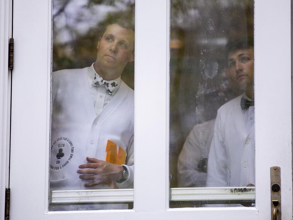 Members of the Naval Academy team wait to make their entrance onto the field.
