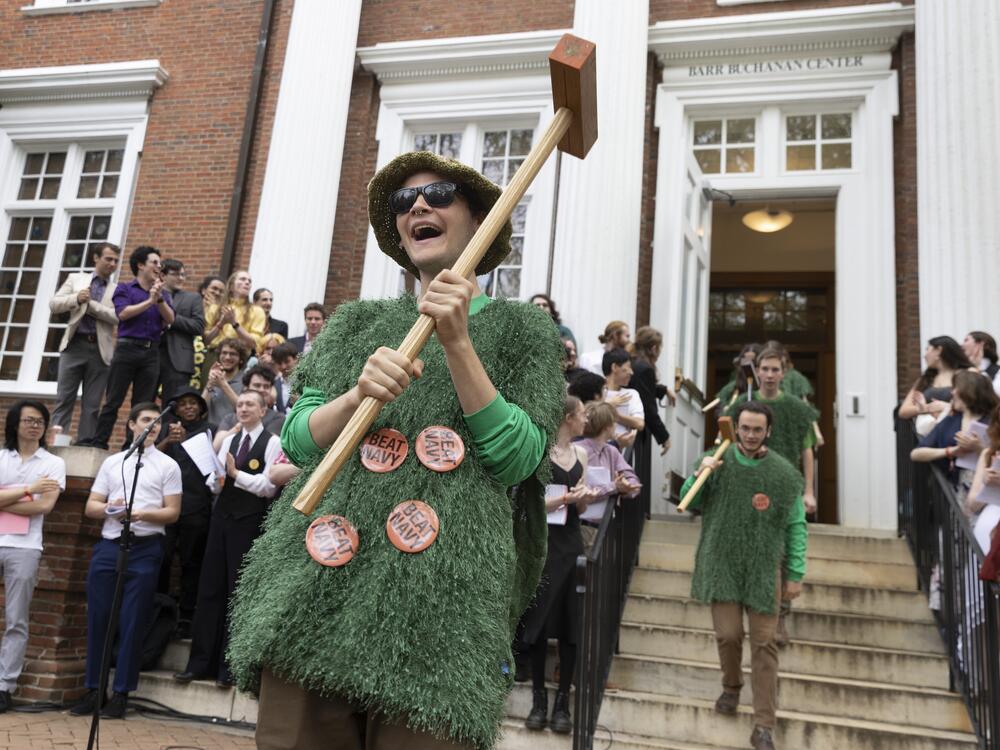 The St. John's College croquet team makes their entrance. The Johnnies' uniforms are a well-kept secret, and this year, they were a recreation of the grass croquet court, complete with mini wickets, balls, mallets and clips.