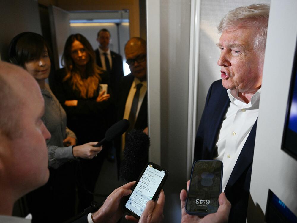 President Trump takes questions from reporters on Air Force One on April 11, 2025.