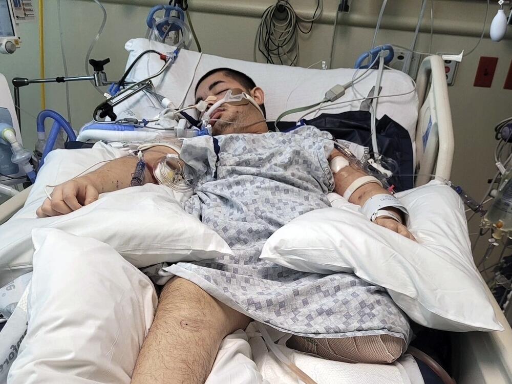 This photo provided by Ana L Vazquez, shows Victor Perez in a hospital bed in Pocatello, Idaho.
