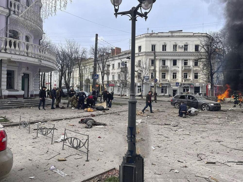 In this photo provided by the Ukrainian Parliament Commissioner for Human Rights Press Service, bodies of the killed residents lie on the ground following a Russian missile attack that killed at least civilia civilians in Sumy, Ukraine, Sunday, April 13, 2025.