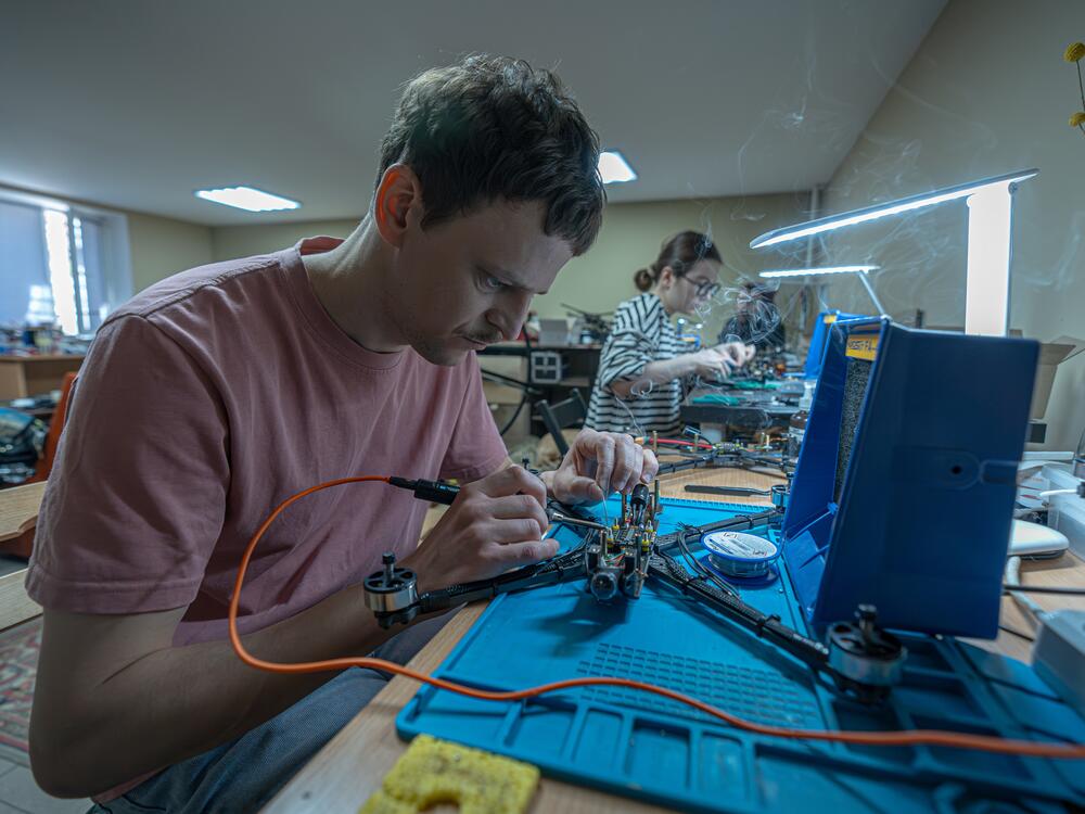 Biophysicist Oleh Halaidych, 34, helps make drones at a workshop in Kyiv. 