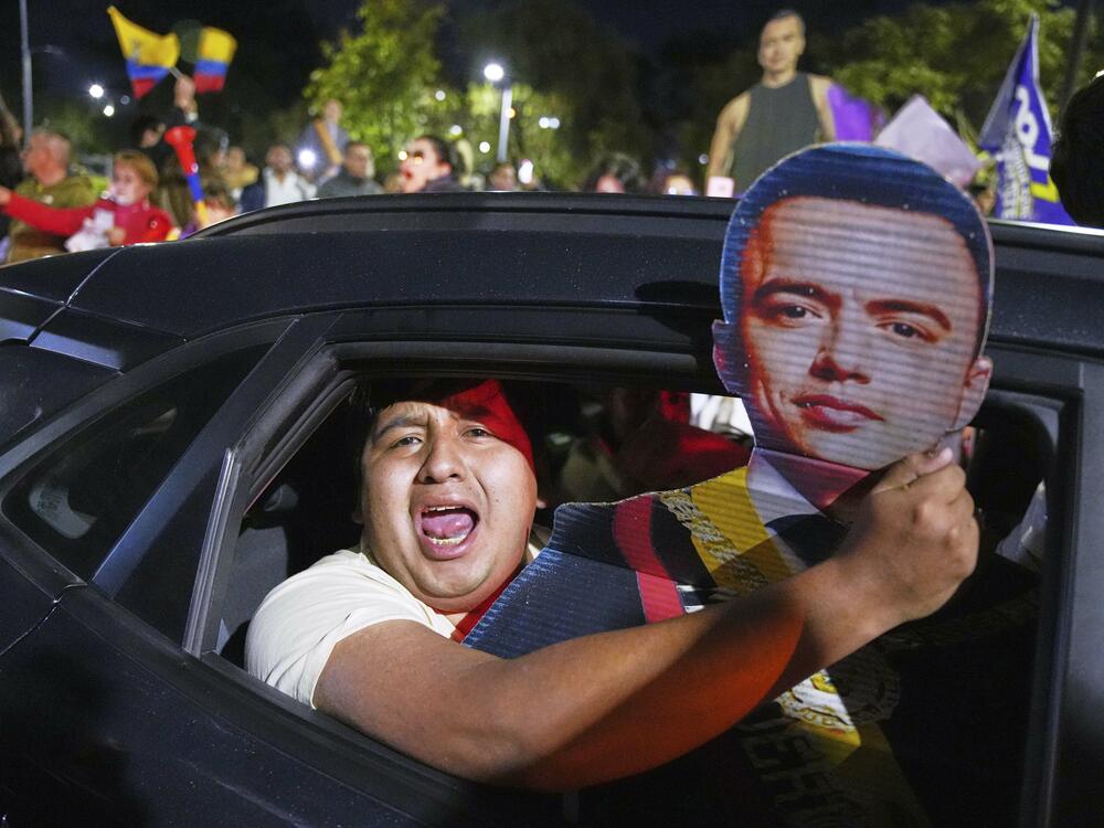 Supporters of President Daniel Noboa celebrate early returns showing him in the lead in the presidential election runoff in Quito, Ecuador, Sunday, April 13, 2025.