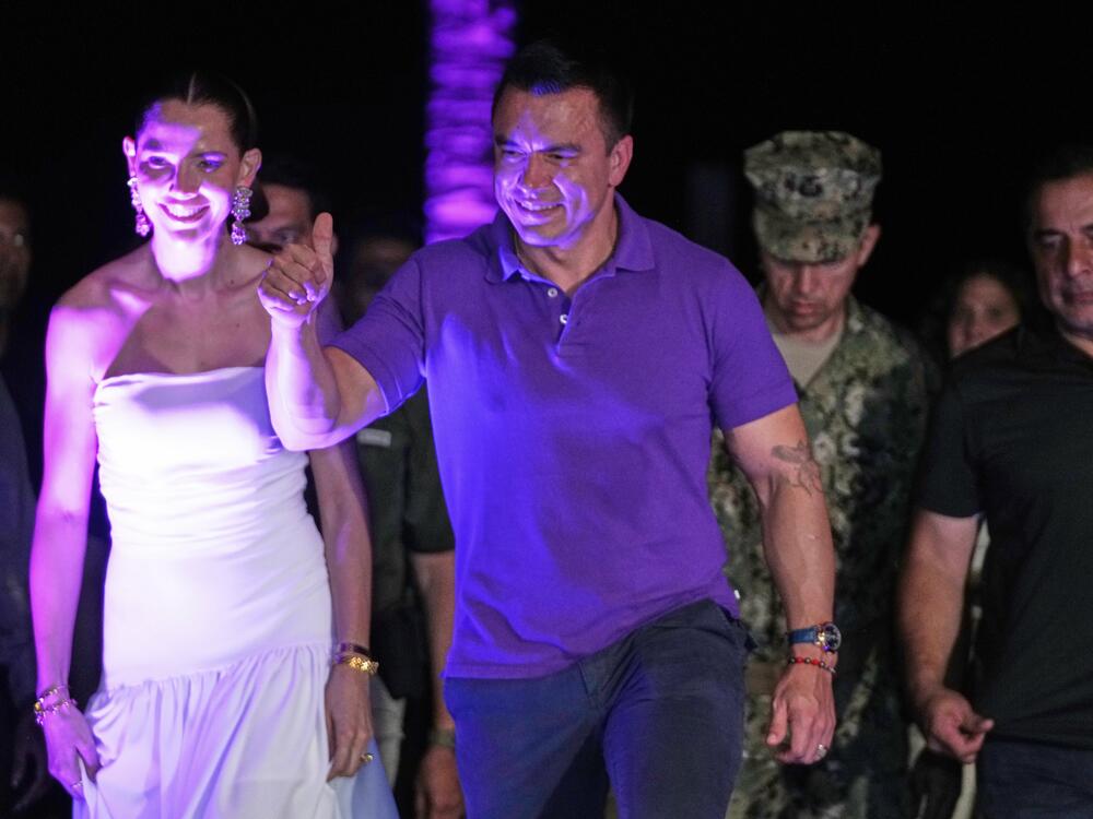 Ecuador's President Daniel Noboa arrives with his wife Lavinia Valbonesi to address supporters at his family home in Olon, Ecuador, Sunday, April 13, 2025.