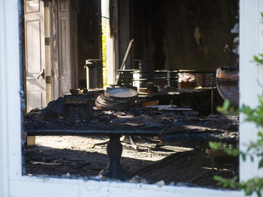 Fire damage is seen inside the Pennsylvania governor's residences following a suspected arson attack Sunday. Police have charged Cody Balmer with attempted murder and other crimes.
