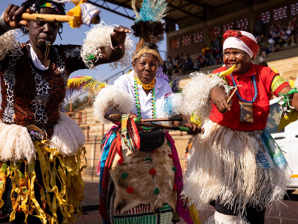 Dancers in traditional dress accompanied South Africa's Mbombela team at the opening ceremony of the grannies tournament, which involved a 15-minute walk from the home of tournament founder Beka Ntsanwisiz to the stadium.
