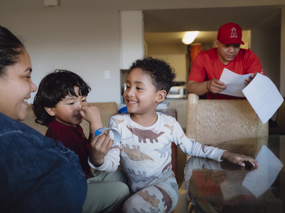 After being away overnight, Yasmelin Valazquez is greeted with joy as her two sons jump on her in a reunion on April 9, 2025.