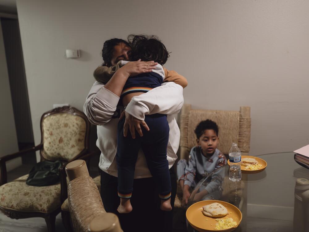 Yasmelin Valazquez wakes up her two sons at 3:30 in the morning to have breakfast before they leave for immigration court. April 10, 2025.