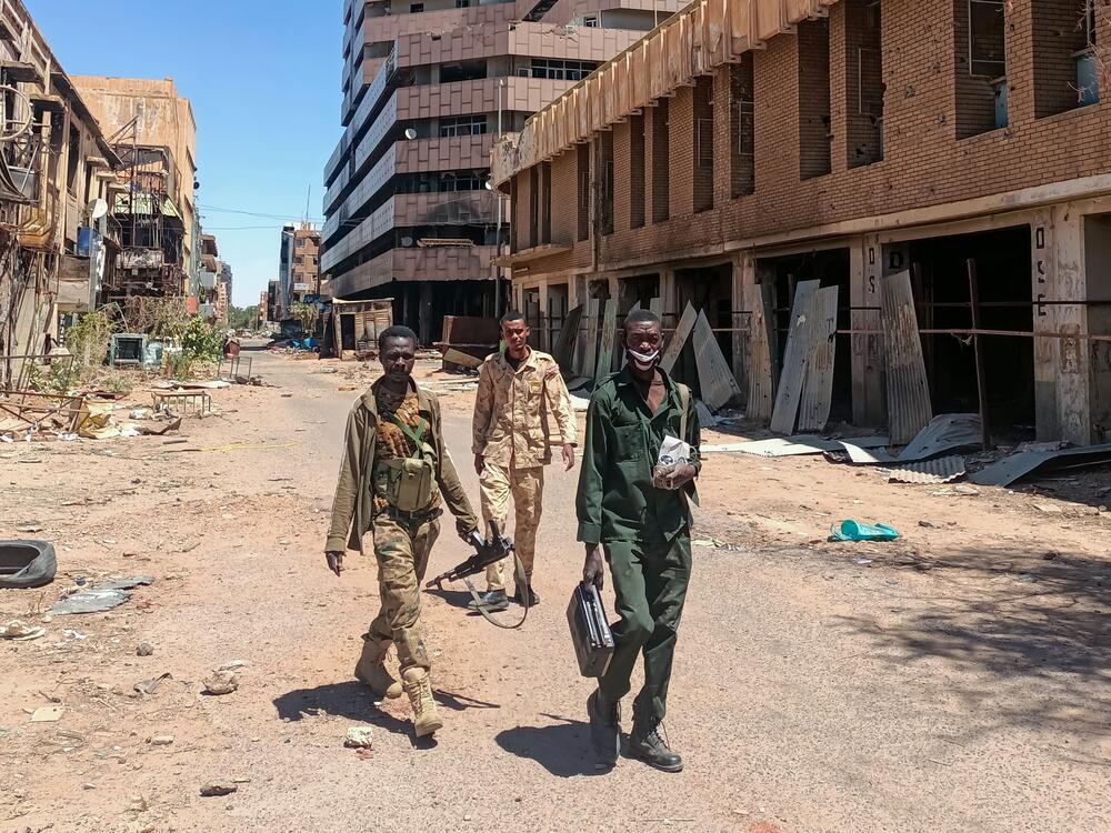 Fighters loyal to the army patrol a market area in Khartoum on March 24, 2025.