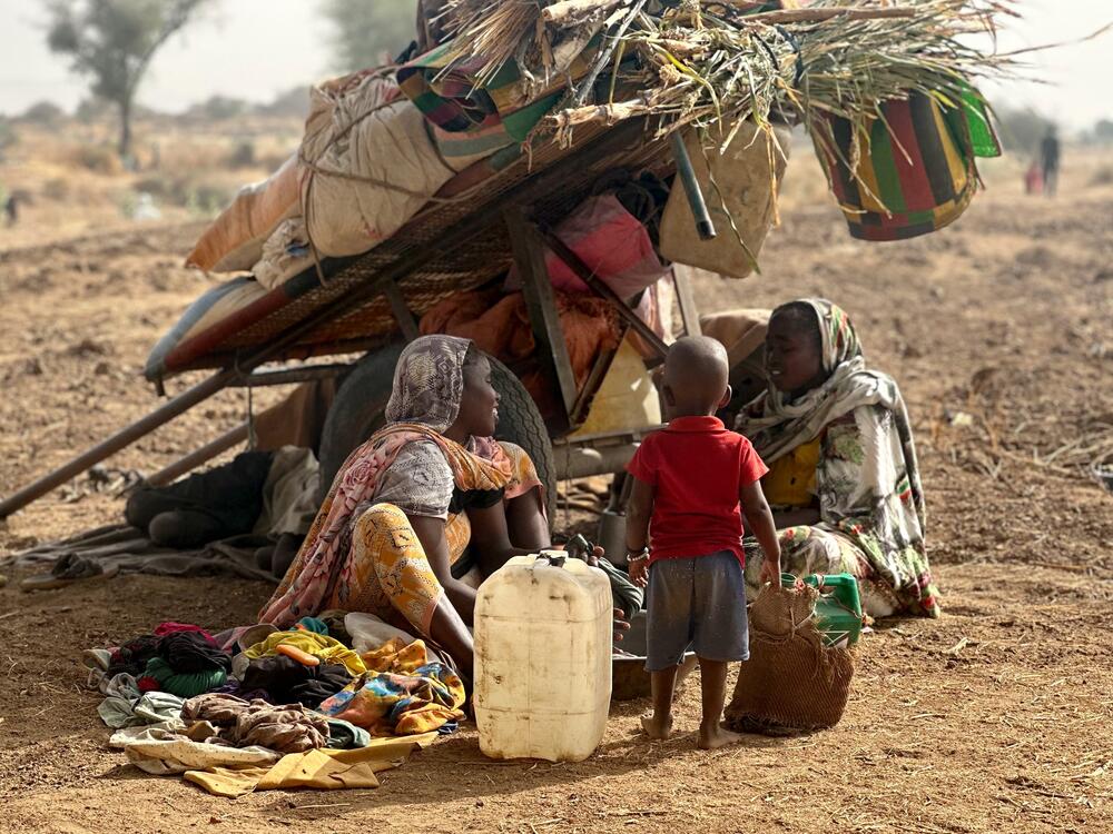 People who fled the Zamzam camp for the internally displaced after it fell under RSF control, rest in a makeshift encampment in an open field near the town of Tawila in war-torn Sudan's western Darfur region on April 13, 2025.