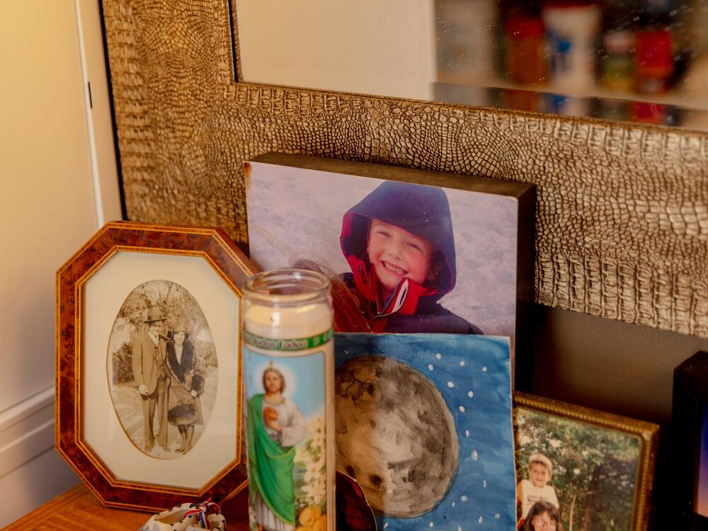 A framed photograph of Logan and his sister, Ayden, sits on a table in the entry of the family's home in Newton, Mass.