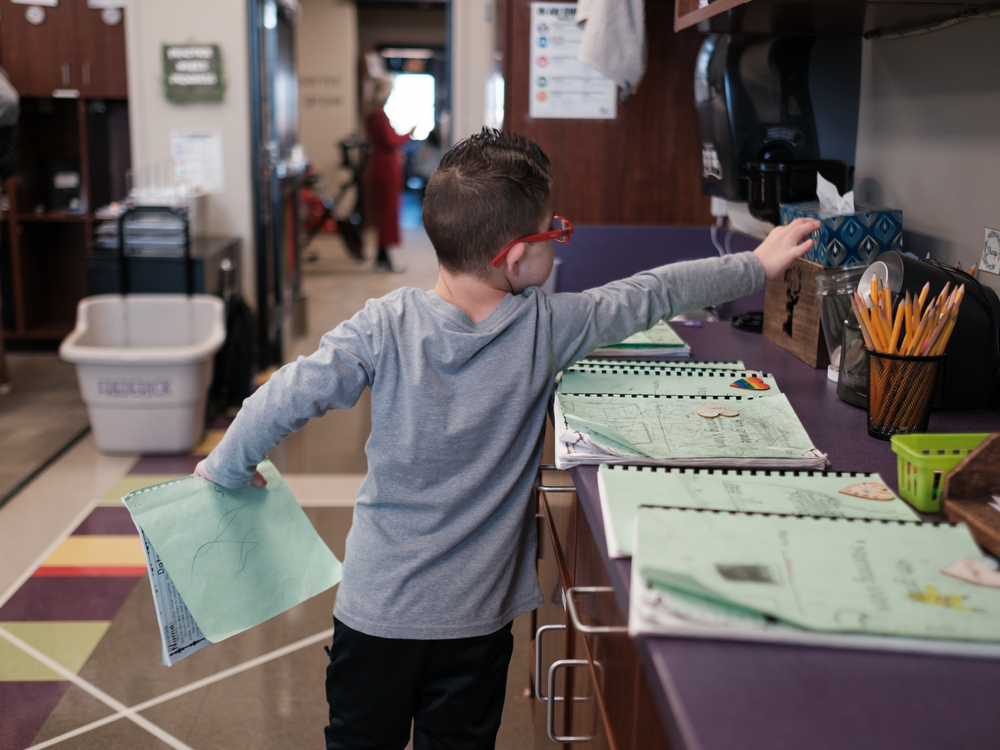 Kellen Hedler prepares to start his school day at Frontier Elementary School in Edmond, Okla.