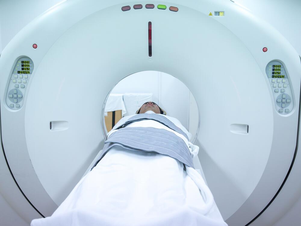 CT scans use ionizing radiation to create cross-sectional images of the body, providing more detail than X-rays.