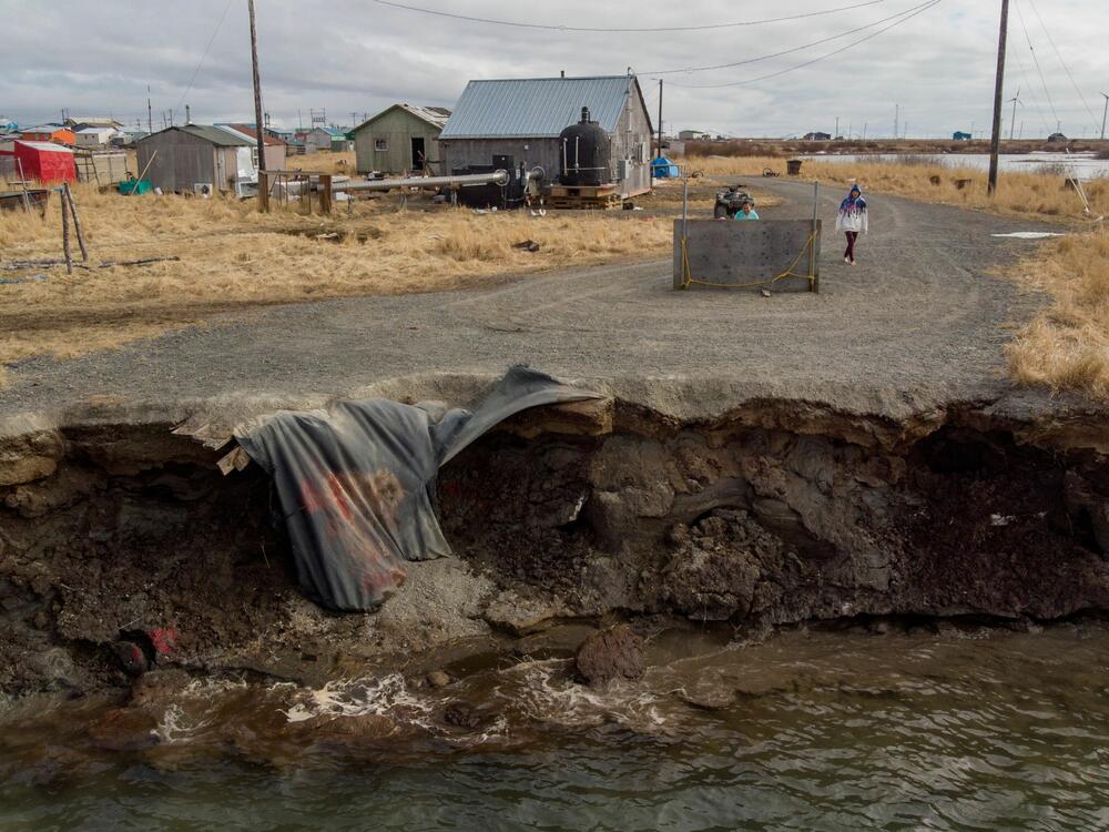 Homes in the Yupik Eskimo Village of Quinhagak on the Yukon Delta in Alaska are threatened by shoreline erosion as climate change makes the planet warmer. More than 22 tribes and nonprofits in the U.S., including Alaska, have had millions of dollars in federal funds for infrastructure projects frozen. Some of those projects were meant to help address the impacts of climate change.