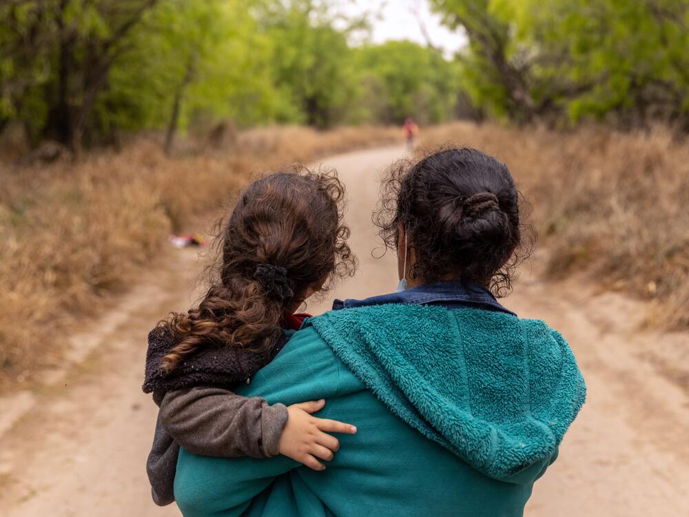 Asylum-seekers from Honduras walk toward a U.S. Border Patrol checkpoint after crossing the Rio Grande from Mexico in 2021 near Mission, Texas.