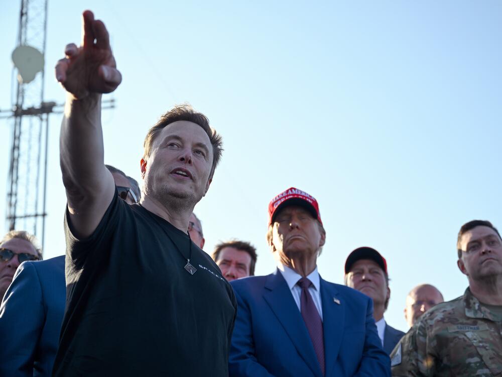Elon Musk speaks with then-President-elect Donald Trump and guests at a viewing of the launch of the sixth test flight of the SpaceX Starship rocket on Nov. 19, 2024, in Brownsville, Texas.