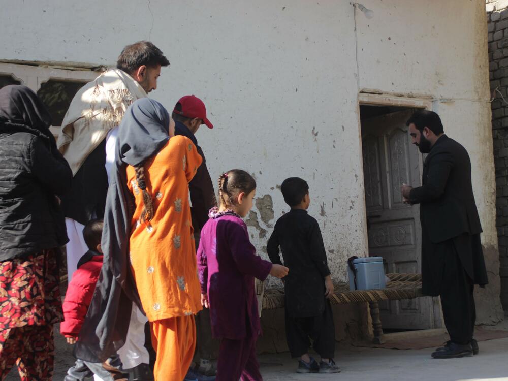 Children wait to receive polio vaccination in Nangarhar province, east Afghanistan, in November 2024 — part of a three-day campaign kicked off in 11 out of Afghanistan's 34 provinces that month, according to the Ministry of Public Health. Sharafat Zaman Amarkhail, the ministry's spokesperson, said 5.3 million children under age 5 were expected to receive vaccine doses during the campaign.