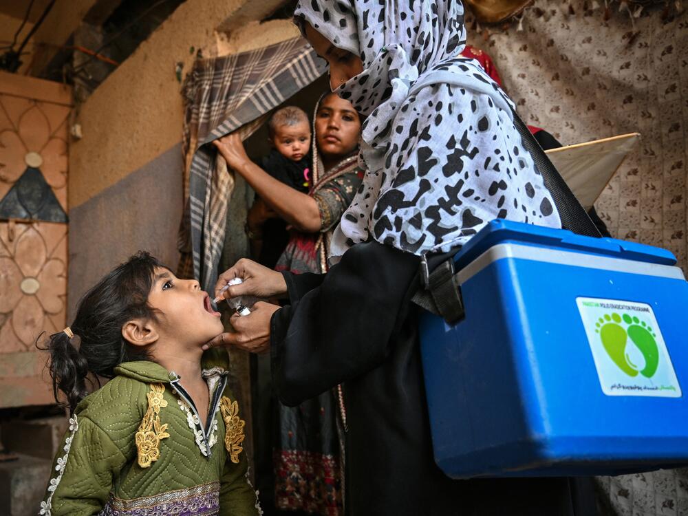 A health worker in Karachi administers polio drops — the oral vaccine — on February 3, the first day of a nationwide polio vaccination campaign. The country, one of only two where wild polio circulates, has seen a rise in cases due to issues with vaccination campaigns.