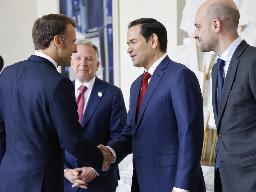 French President Emmanuel Macron (left) shakes hands with U.S. Secretary of State Marco Rubio next to special envoy Steve Witkoff (center) and France's foreign minister, Jean-Noël Barrot, before a meeting at the Élysée presidential palace in Paris on Thursday.