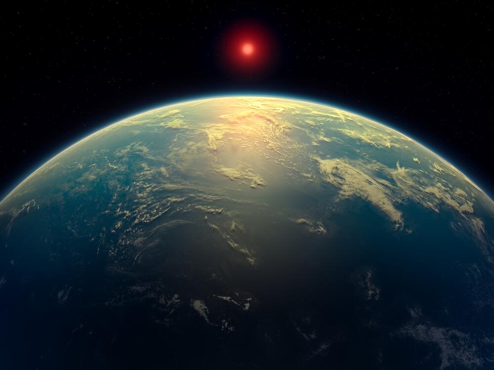 This artist's impression depicts what a water world with a hydrogen atmosphere, such as planet K2-18b, might look like.