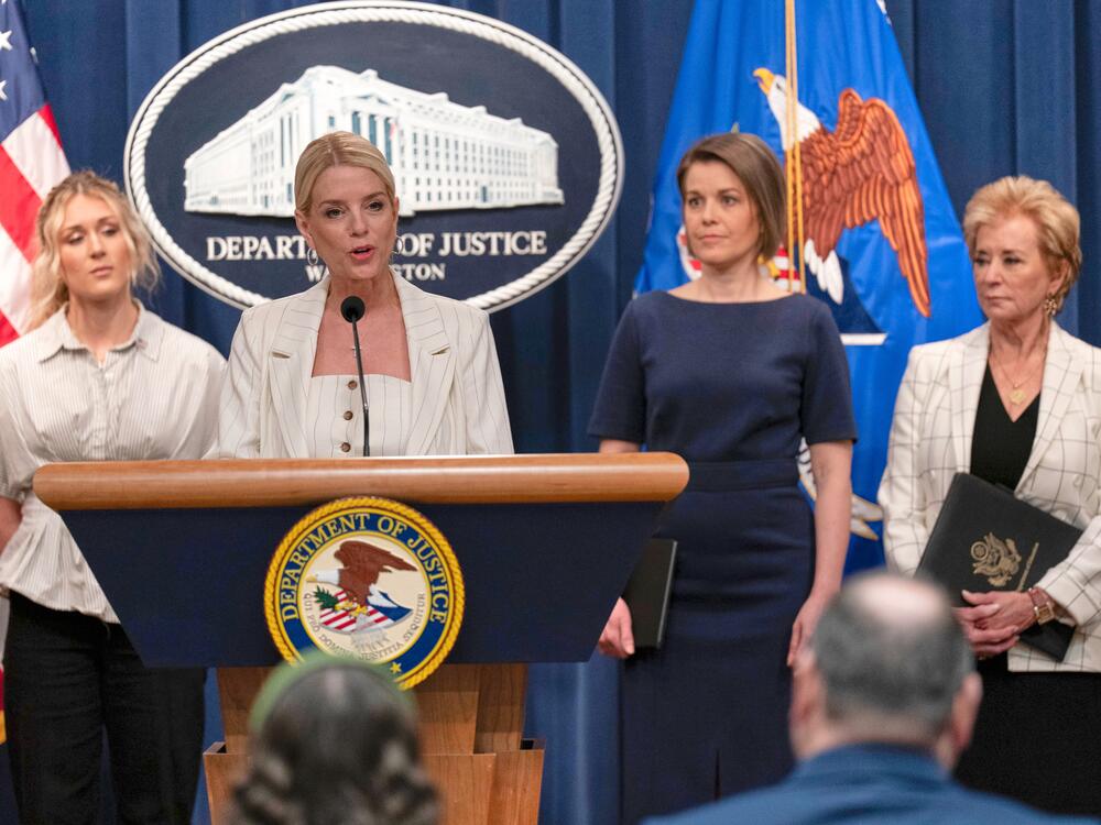 Attorney General Pam Bondi spoke at the Justice Department on Wednesday to announce that the administration is suing Maine for not complying with the government's push to ban transgender athletes in girls sports. She was accompanied by (from left) Riley Gaines, Rep. Laurel Libby, R-Maine, and Education Secretary Linda McMahon.