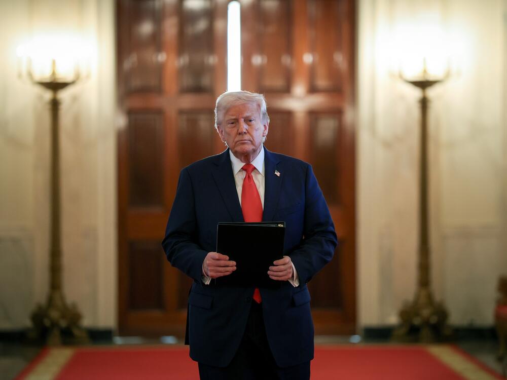 President Trump arrives for a presentation ceremony for the Commander-in-Chief Trophy to the U.S. Naval Academy in the East Room of the White House on Tuesday.
