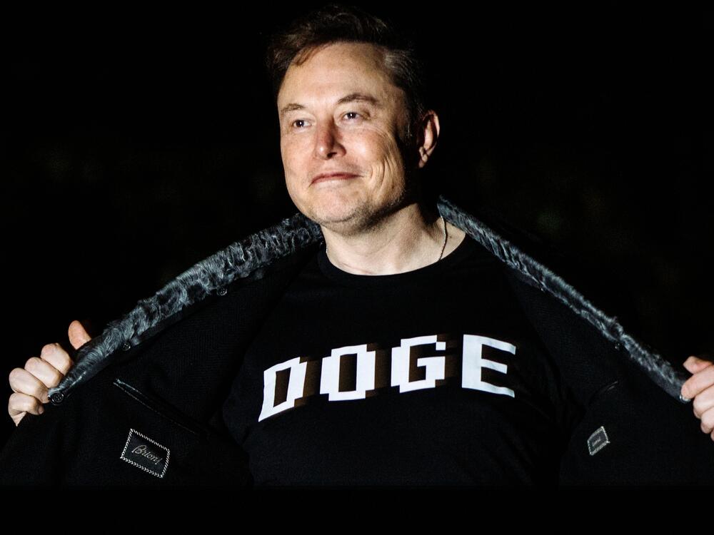 Elon Musk walks to the White House after landing in Marine One on the South Lawn with  President Trump (not pictured) in Washington, D.C., on March 9, 2025.