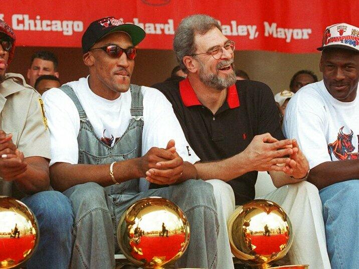 Chicago Bulls Dennis Rodman, Scottie Pippen, coach Phil Jackson and Michael Jordan celebrating their 4th NBA championship in 1996. Chicago's dominance of basketball in the 1990s established the Bulls as a cultural force and worldwide brand.