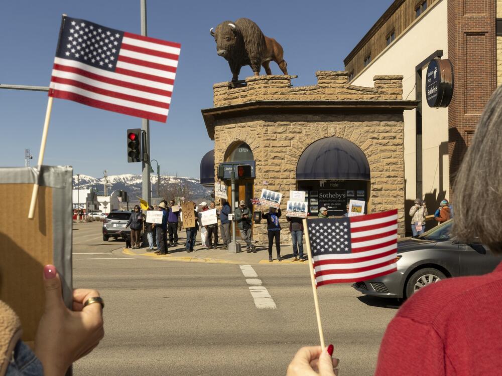 Demonstrators gather in Driggs, Idaho, to protest against President Trump and his administration.