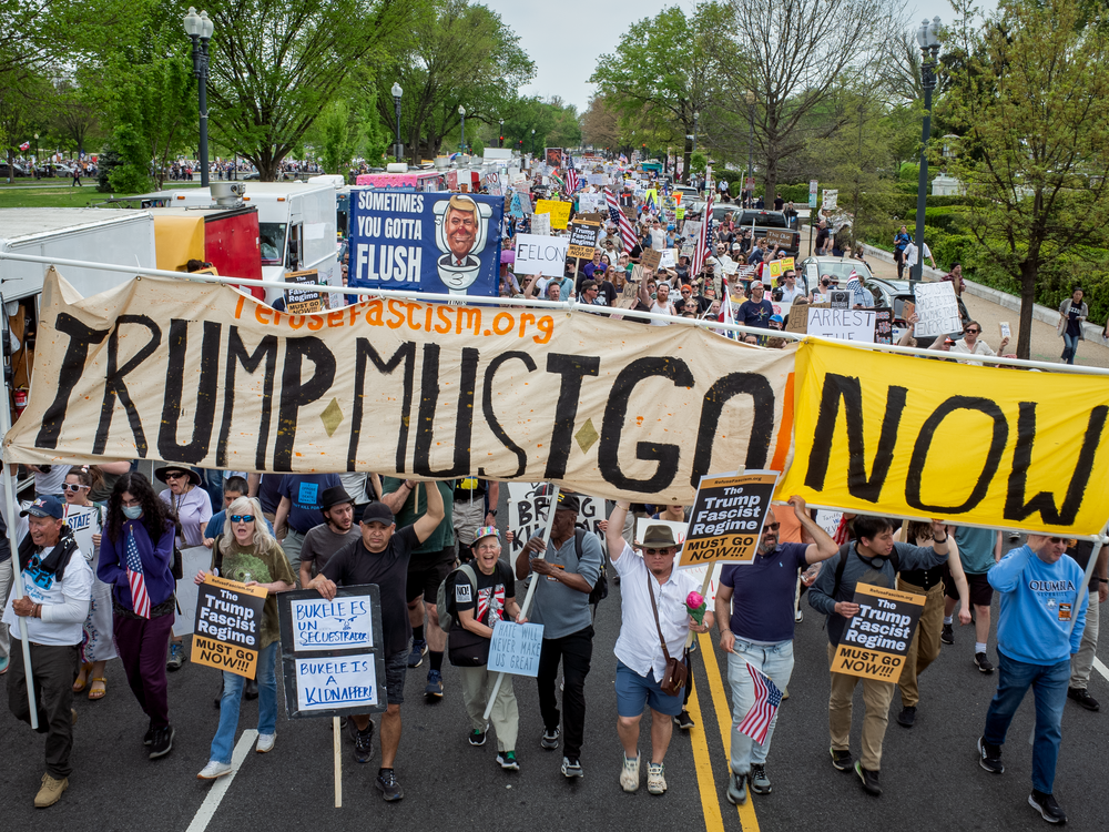 Demonstrators march in Washington, D.C., during nationwide protests against the Trump administration.