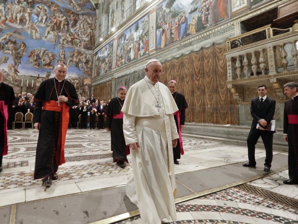 Pope Francis leaves after taking a family photo with diplomats accredited to the Holy See inside the Sistine Chapel at the end of an audience for the traditional exchange of New Year greetings at the Vatican on Jan. 8, 2018.