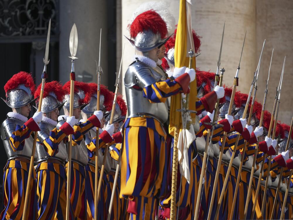 Swiss Guards line up in front of St. Peter's Basilica at the Vatican, Wednesday, Dec. 25, 2024. (AP Photo/Andrew Medichini)