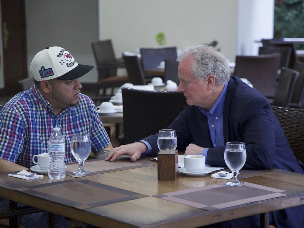 In this photo released by Senator Van Hollen's press office, Hollen, right, speaks with Kilmar Abrego Garcia, a Salvadorian citizen who was living in Maryland and deported to El Salvador by the Trump administration, in a hotel restaurant in San Salvador, El Salvador, Thursday, April 17, 2025. (Press Office Senator Van Hollen, via AP)