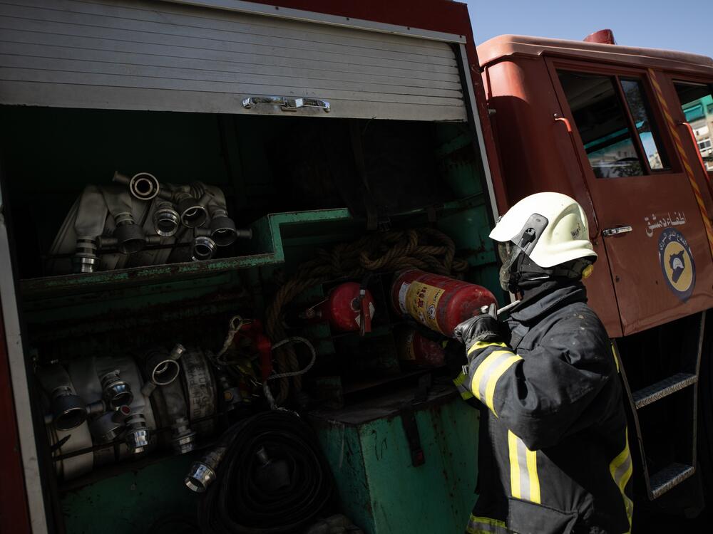 The White Helmets respond to a firefighting call in Damascus on March 31.