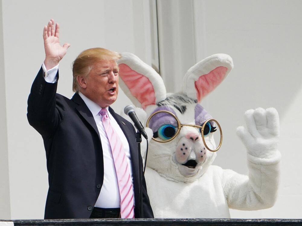 President Trump and the Easter Bunny wave during the annual White House Easter Egg Roll on the South Lawn on April 22, 2019.