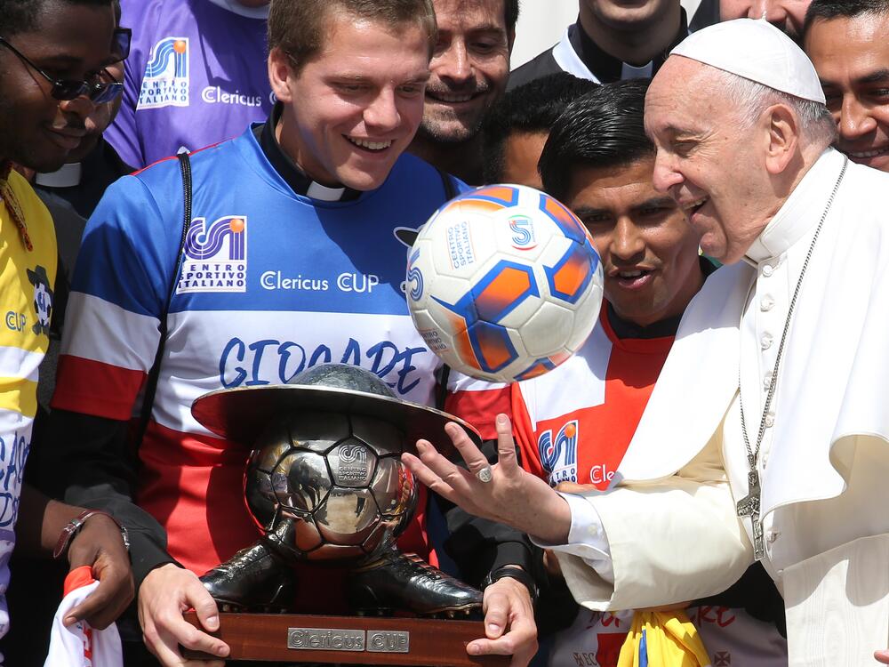 Pope Francis plays with a ball as he meets players in the Clericus Cup on May 29, 2019, in Vatican City.