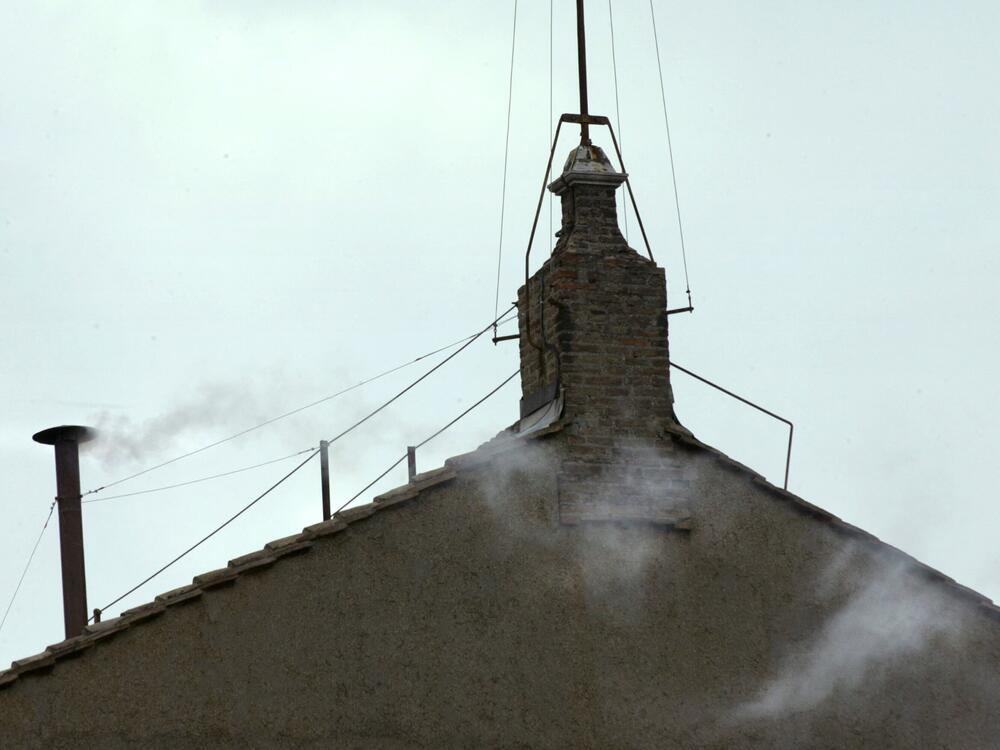 White smoke vents up from the chimney of the Sistine Chapel on April 19, 2005, meaning that Catholic Church cardinals elected a new leader after a conclave lasting little more than 24 hours.