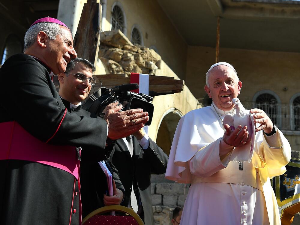 Pope Francis releases a dove during a ceremony in Mosul, Iraq, in March 2021.