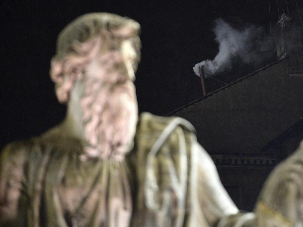 White smoke rises from the chimney on the roof of the Sistine Chapel on March 13, 2013 at the Vatican after Argentina's Jorge Mario Bergoglio was elected Pope Francis.
