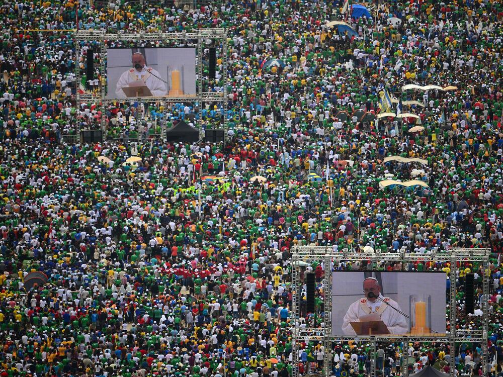 Hundreds of thousands of people crowd Rio de Janeiro's Copacabana Beach on July 28, 2013, as Pope Francis celebrates the final Mass of his visit to Brazil.