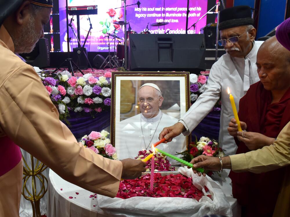 People attend an interfaith memorial meeting to mourn the death of Pope Francis in New Delhi, India, on Monday.