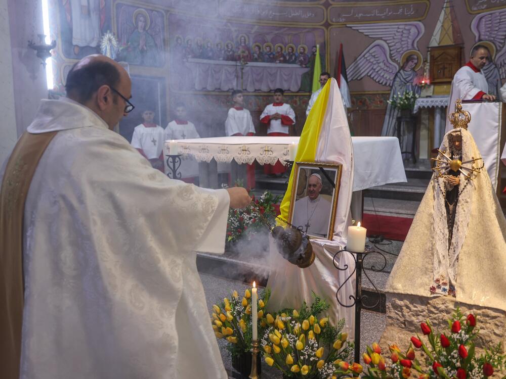 Members of the clergy hold Mass for late Pope Francis at the Holy Family Church in Gaza City on Monday. Palestinian Christians in Gaza mourned the death of Pope Francis, who had maintained close and consistent contact with the besieged territory's small Christian community throughout the ongoing war with Israel.