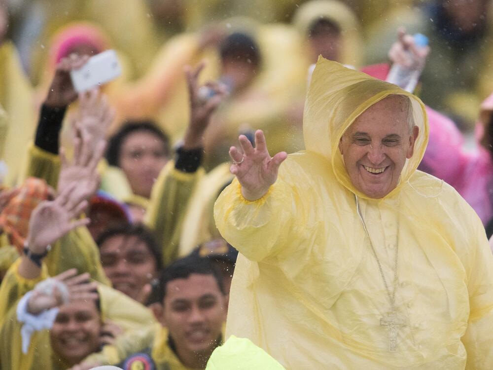 Pope Francis waved to well-wishers after a mass in Tacloban on January 17, 2015. He spent a day in the Philippines with survivors of a catastrophic super typhoon that claimed thousands of lives, highlighting his concern over climate change.